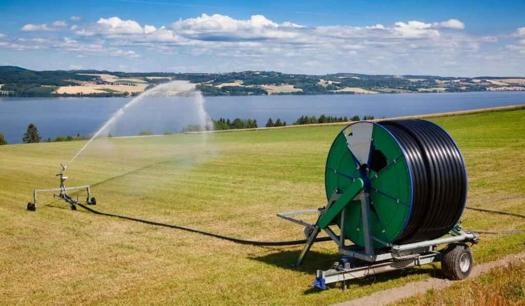 watering field with a travelling sprinkler