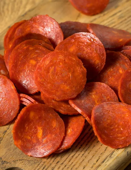 pepperoni on chopping board