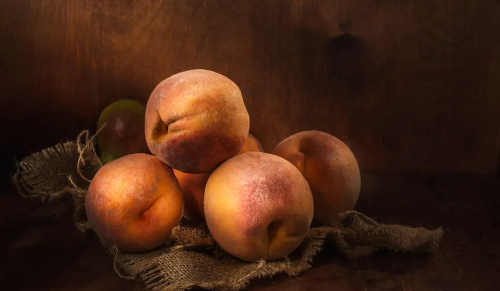 August Pride Peaches on wooden background