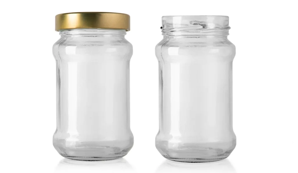 empty glass jar for food and canned food. Isolated on white background with clipping path