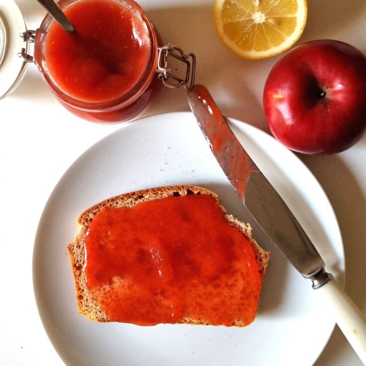 plum and apple jam spread on a piece of bread
