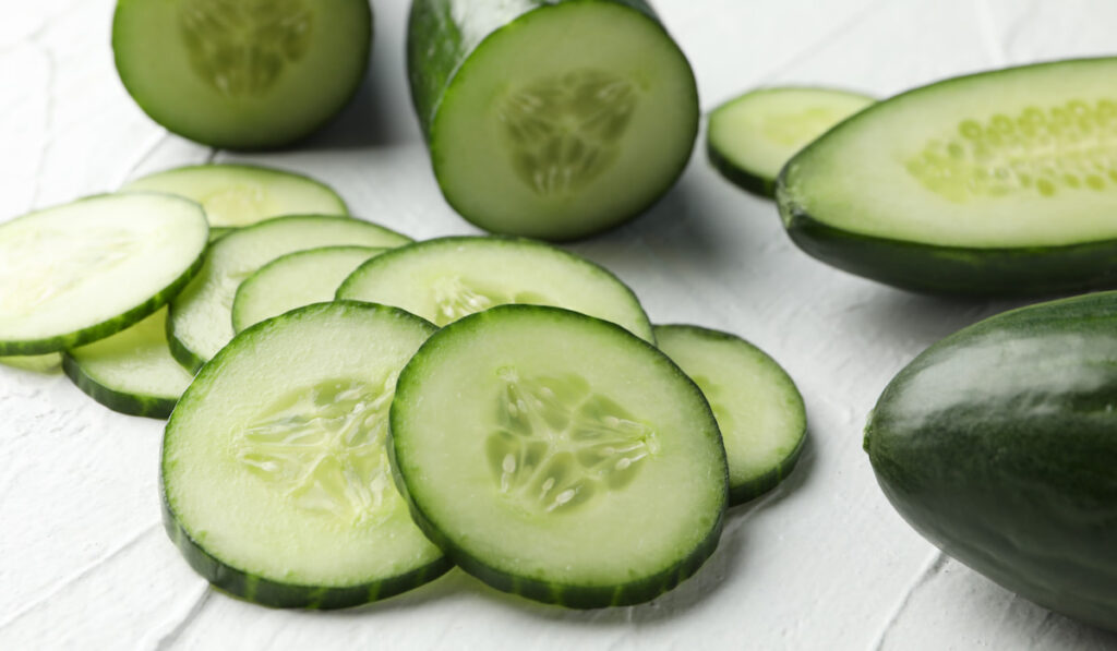 slices of cucumbers on white background