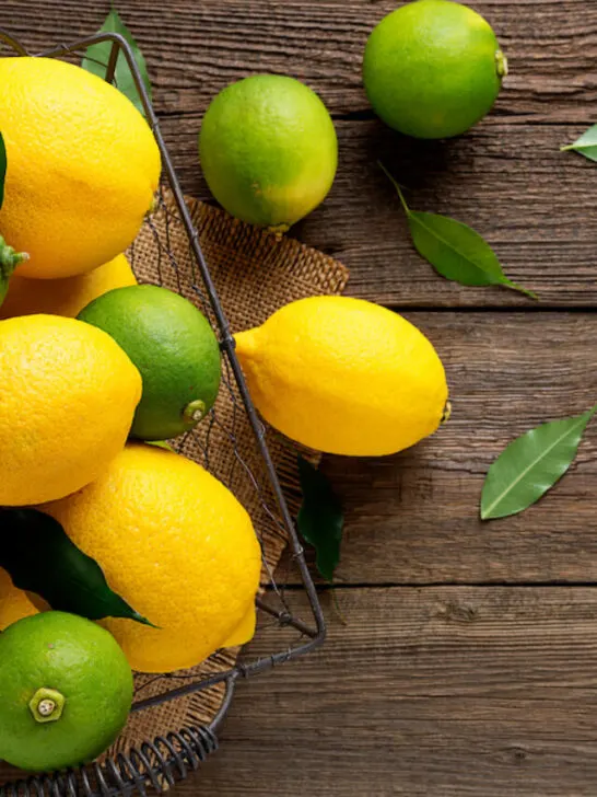 lemons and limes on a metal basket