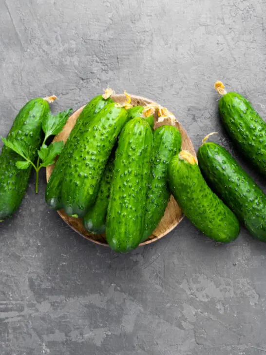 Fresh cucumbers on rustic stone background - ee230530