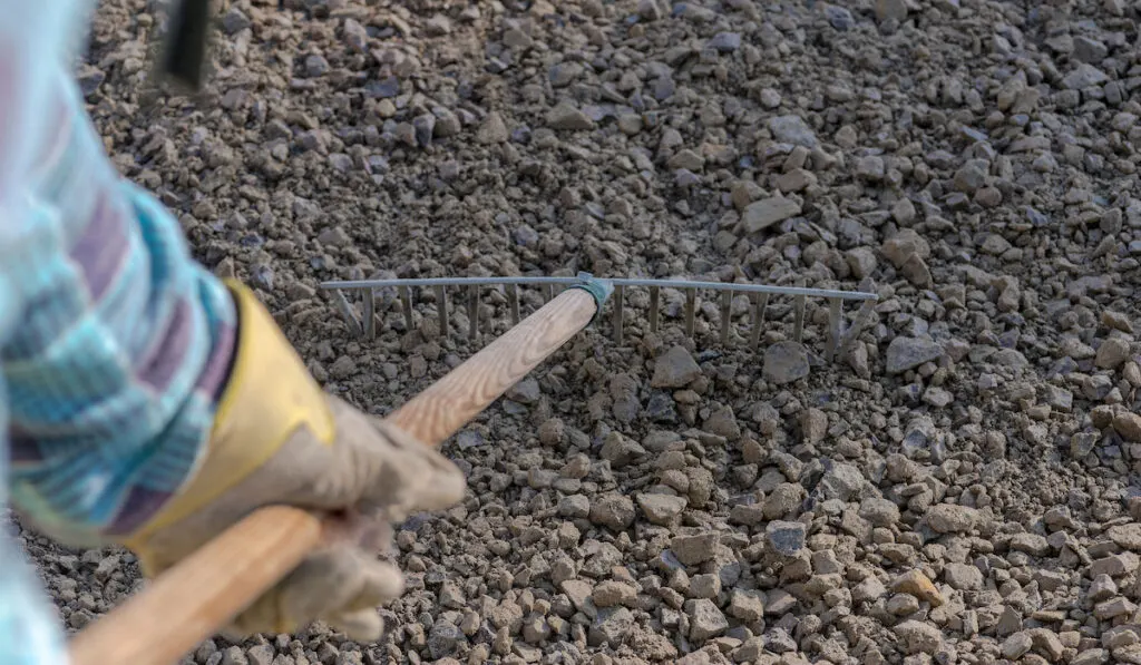 Leveling gravel (as a base for the driveway) using a rake